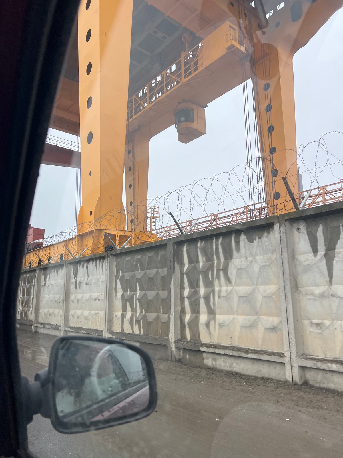 Industrial scene with yellow crane documented in Noviy, Russia