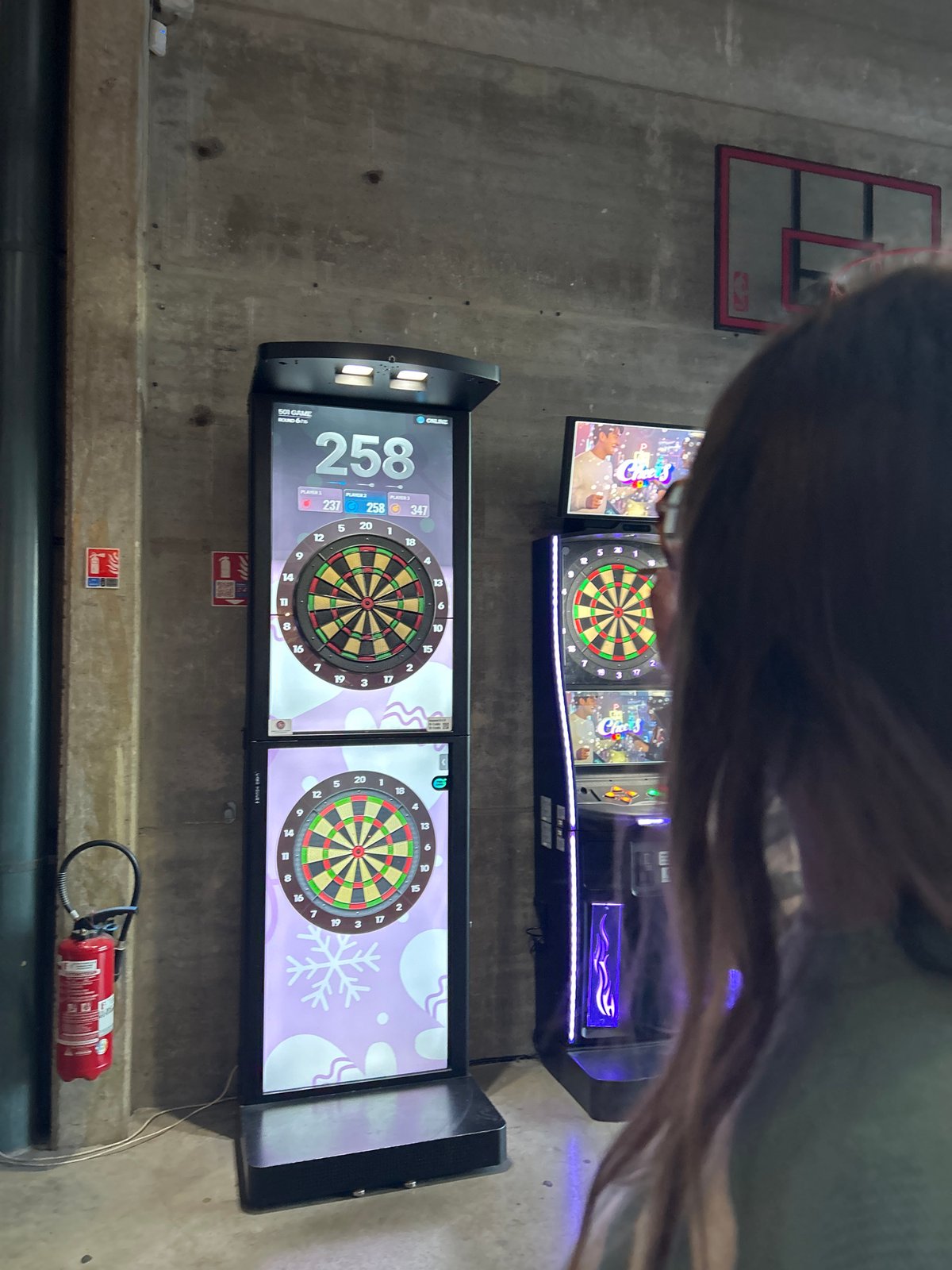 Dart game in progress at Villeneuve-d'Ascq entertainment venue