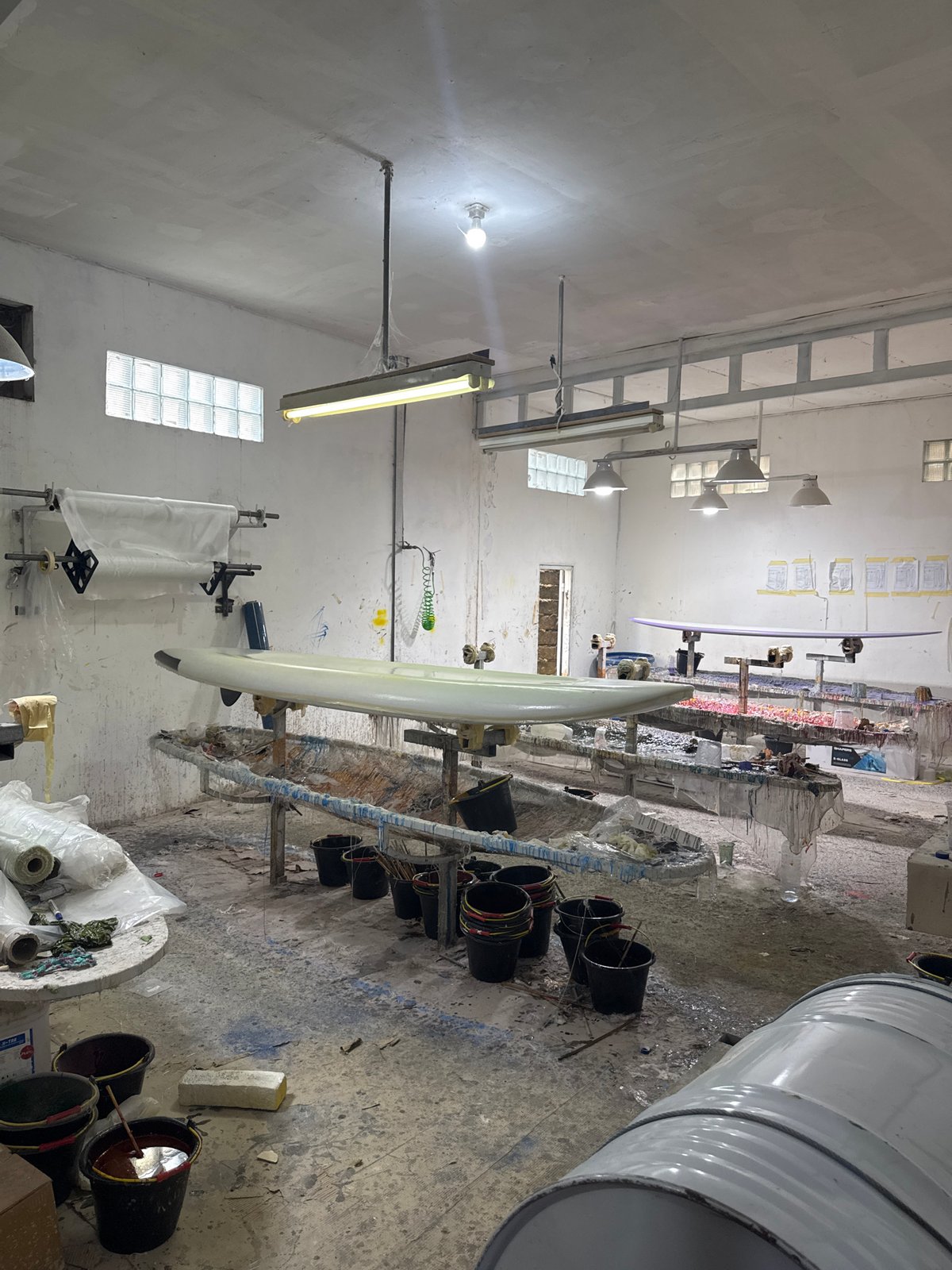 Early morning activity captured at Denpasar surfboard workshop