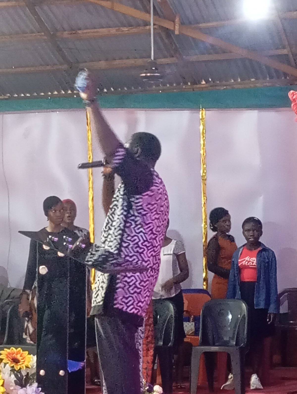 Community gathering with speaker and music in Markurdi church