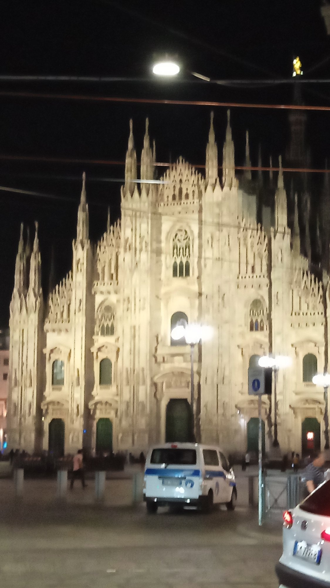 Milan's Duomo district at night, Gothic architecture lit up