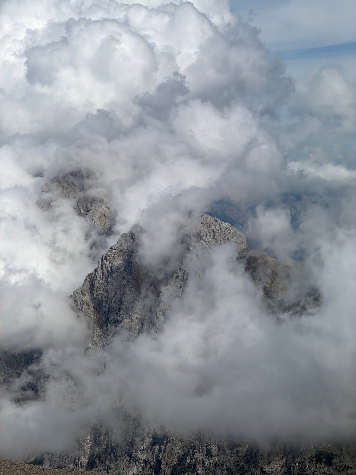 Hiking through cloud-wrapped rocky peaks above Garmisch-Partenkirchen