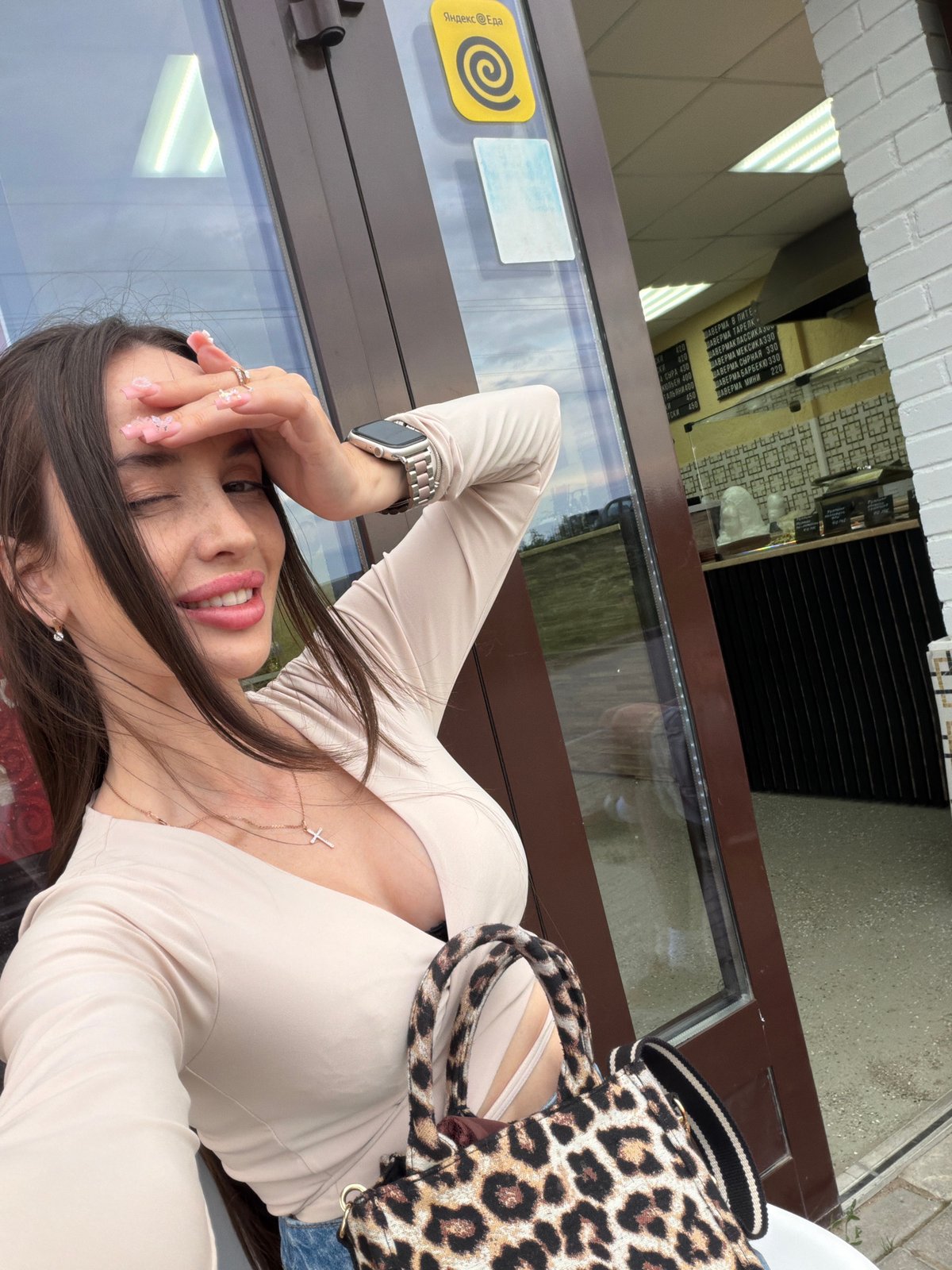 Woman documents casual photo session on Saint Petersburg streets