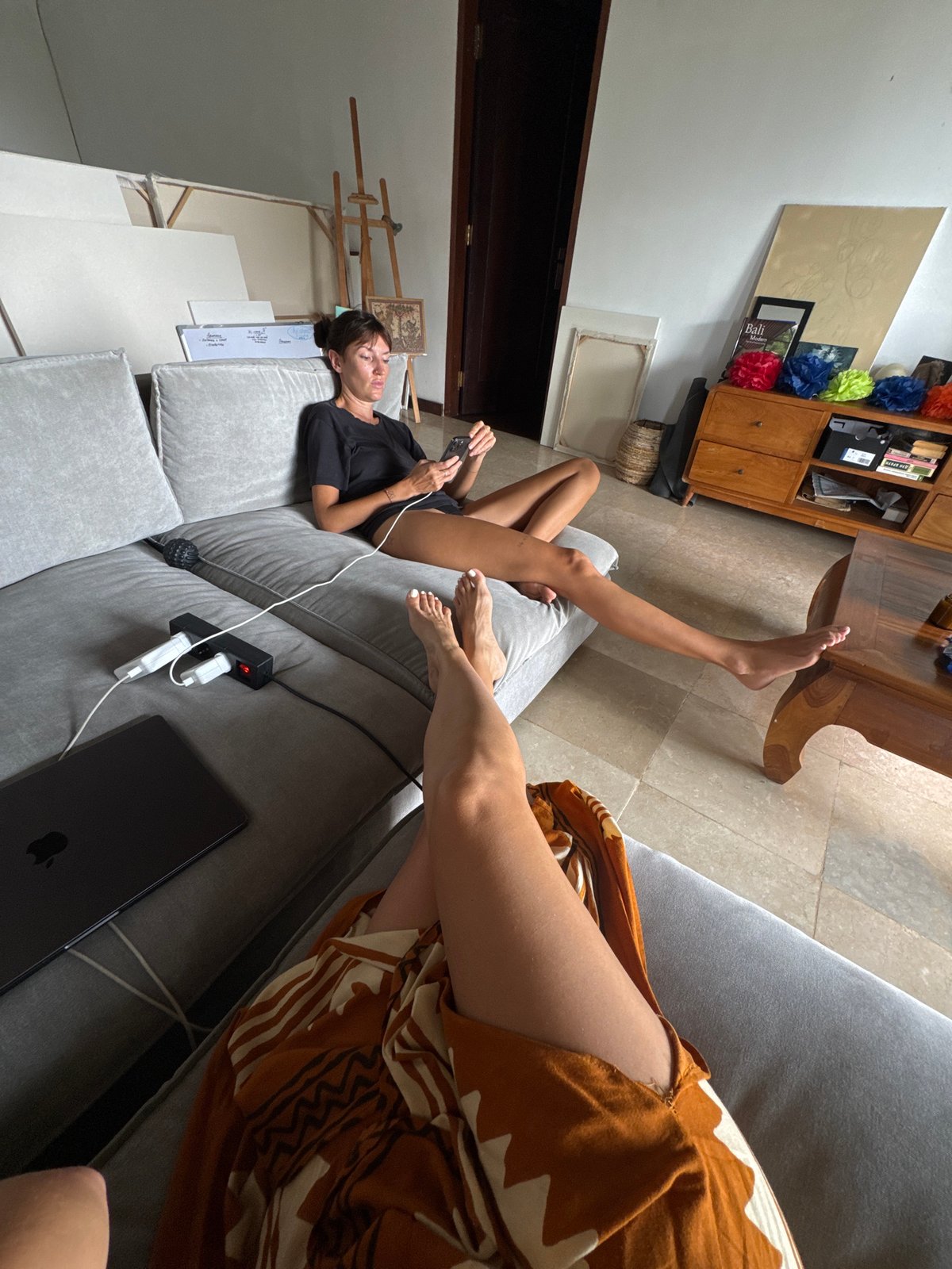 Two women relax indoors in Kuta Selatan