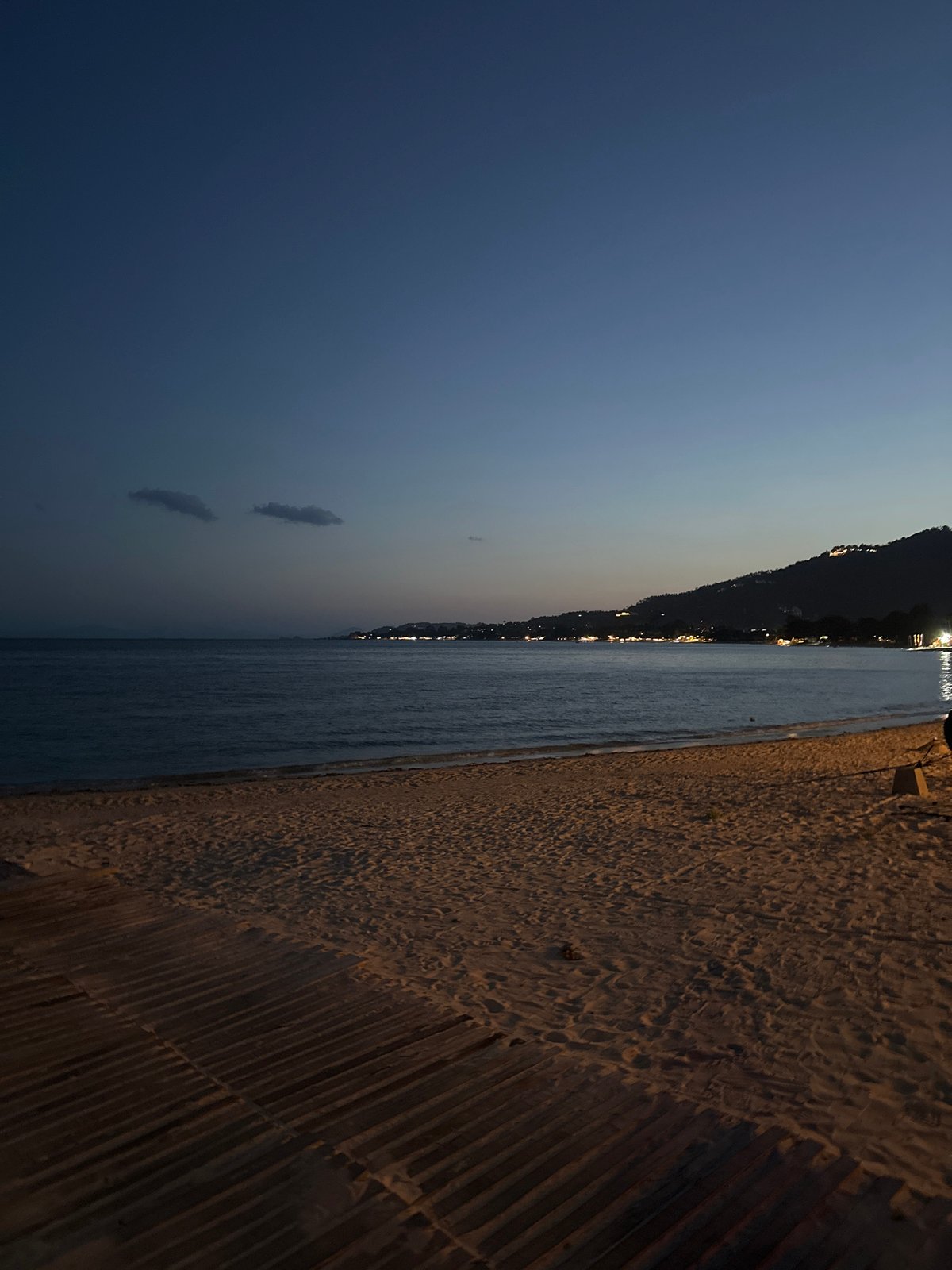 Dusk falls over Ko Samui's beaches, harbor, and lit-up restaurants