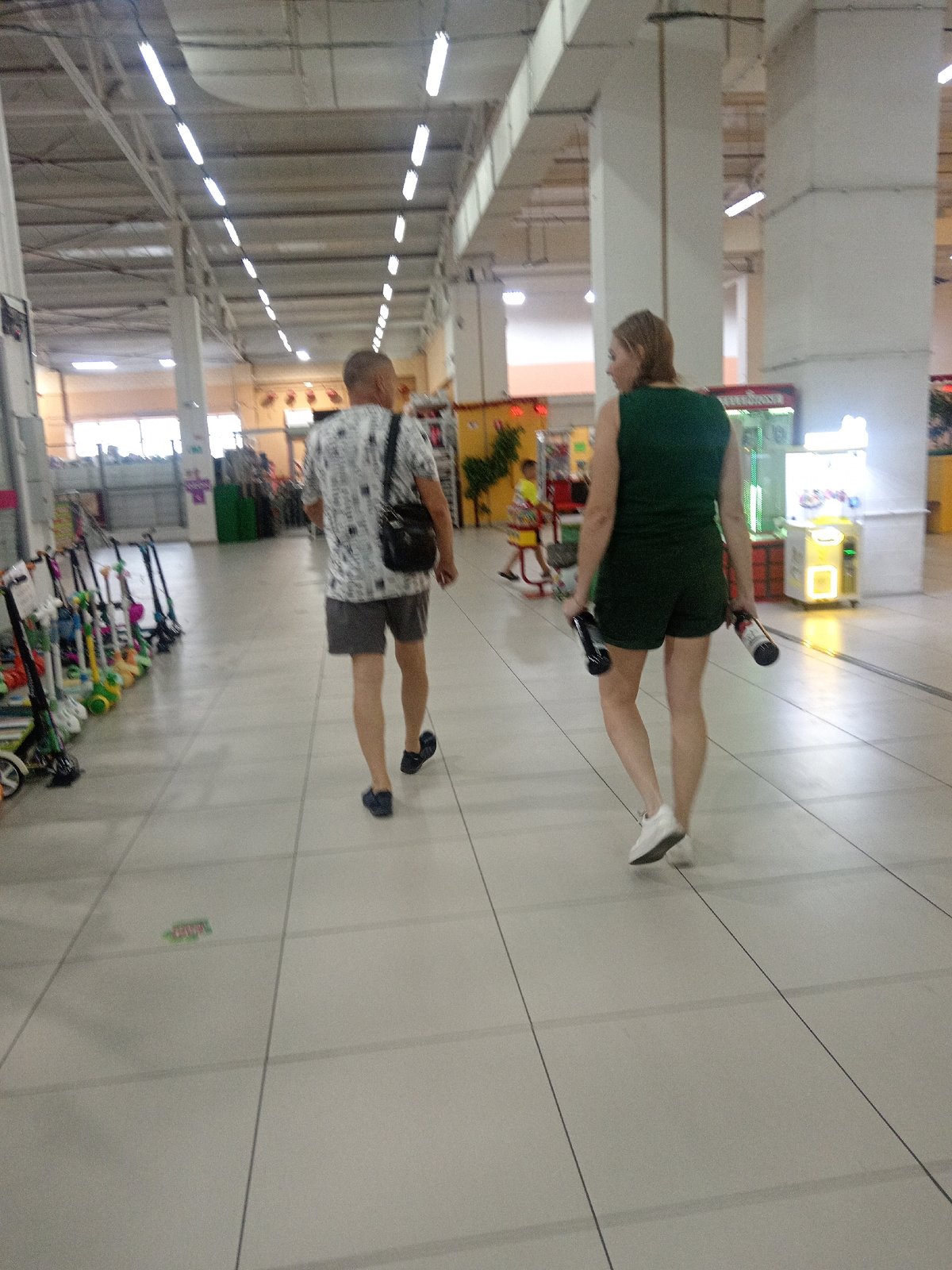 Browsing a Belogorsk shopping complex on a rainy summer morning