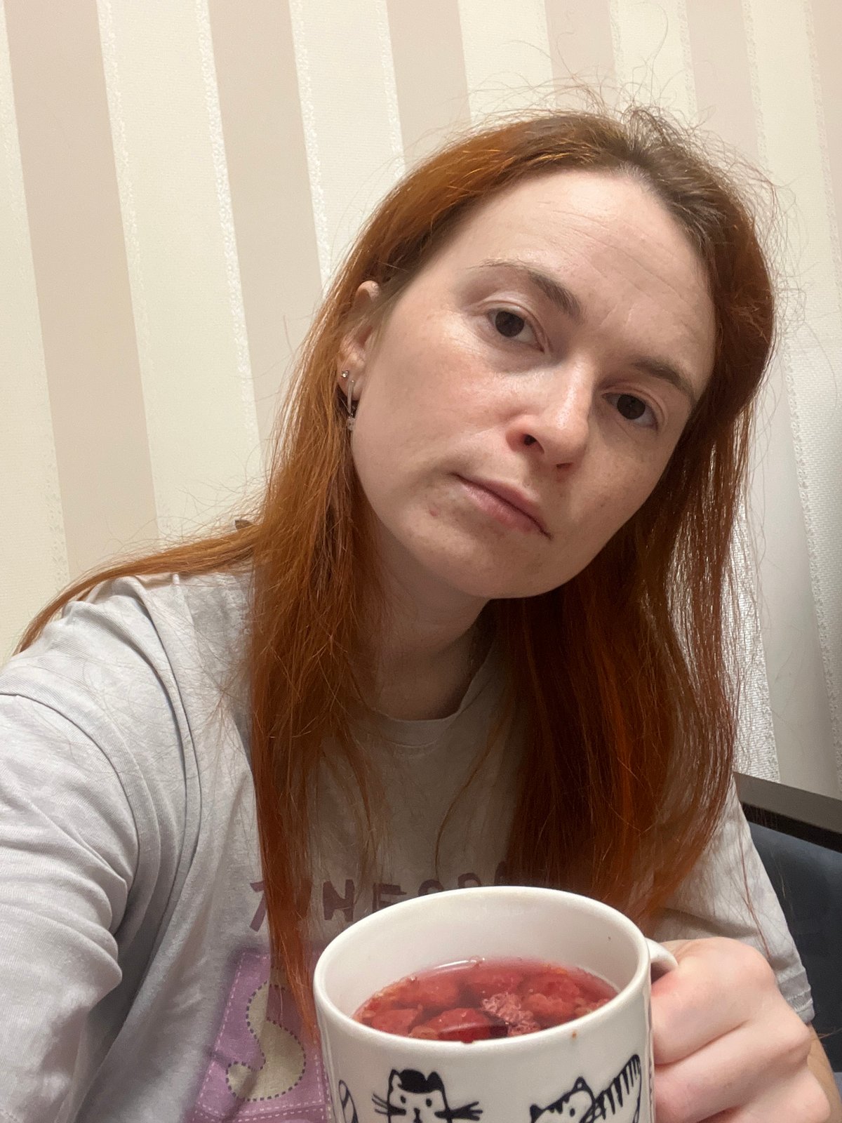 Russian resident documents cat, seedlings, houseplants in morning photography session