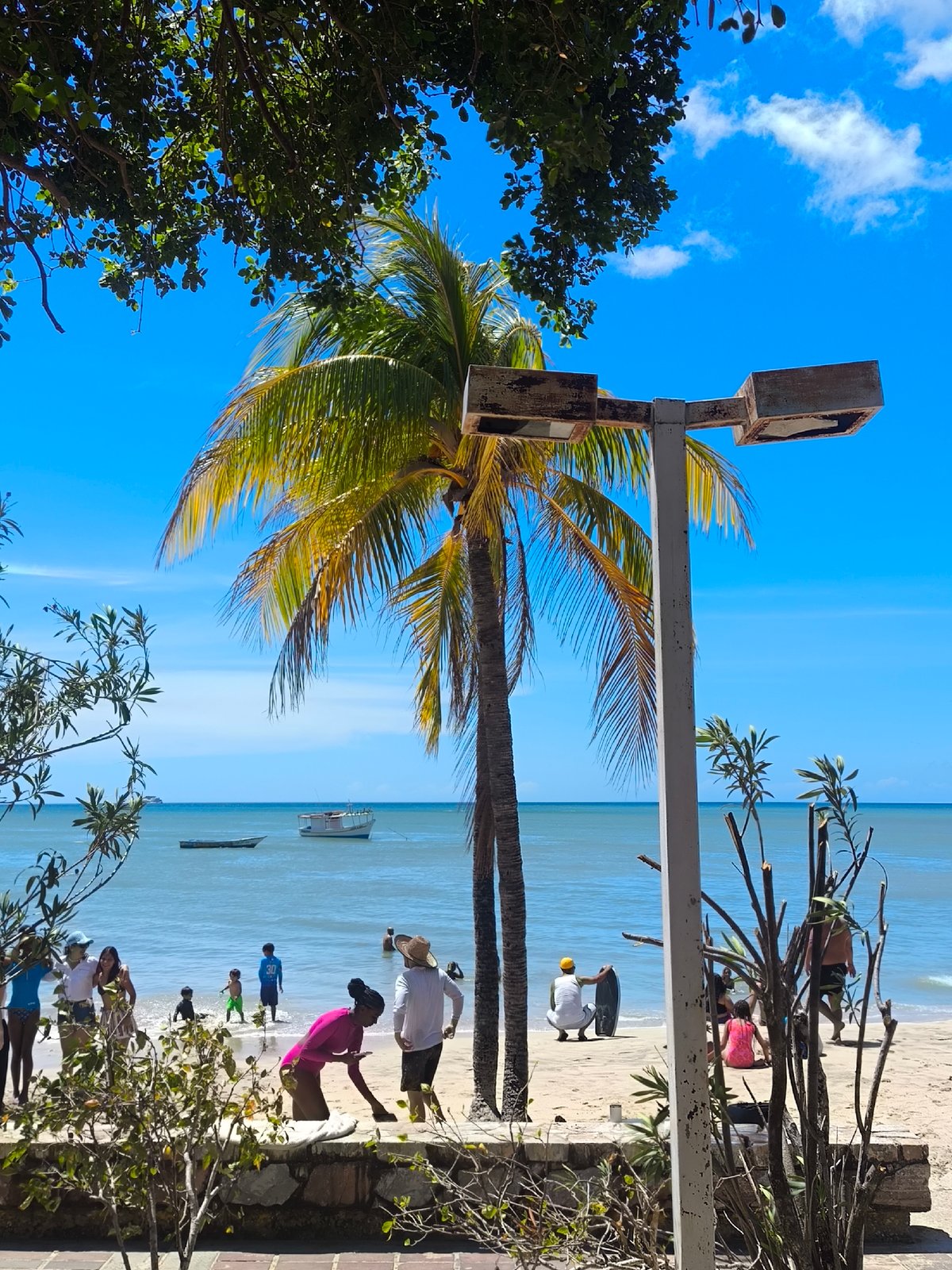 Beach activities and building views captured in Pedro González