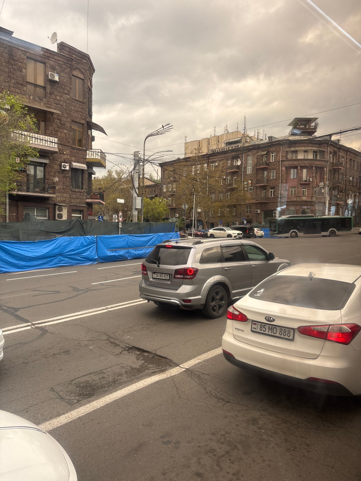Morning street scene captured in Yerevan with parked vehicles