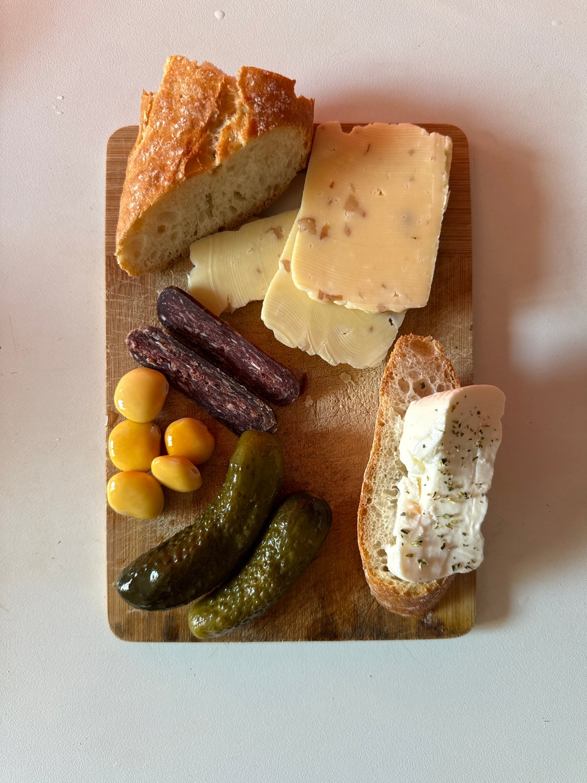 Food arrangement photographed on wooden cutting board in Milan