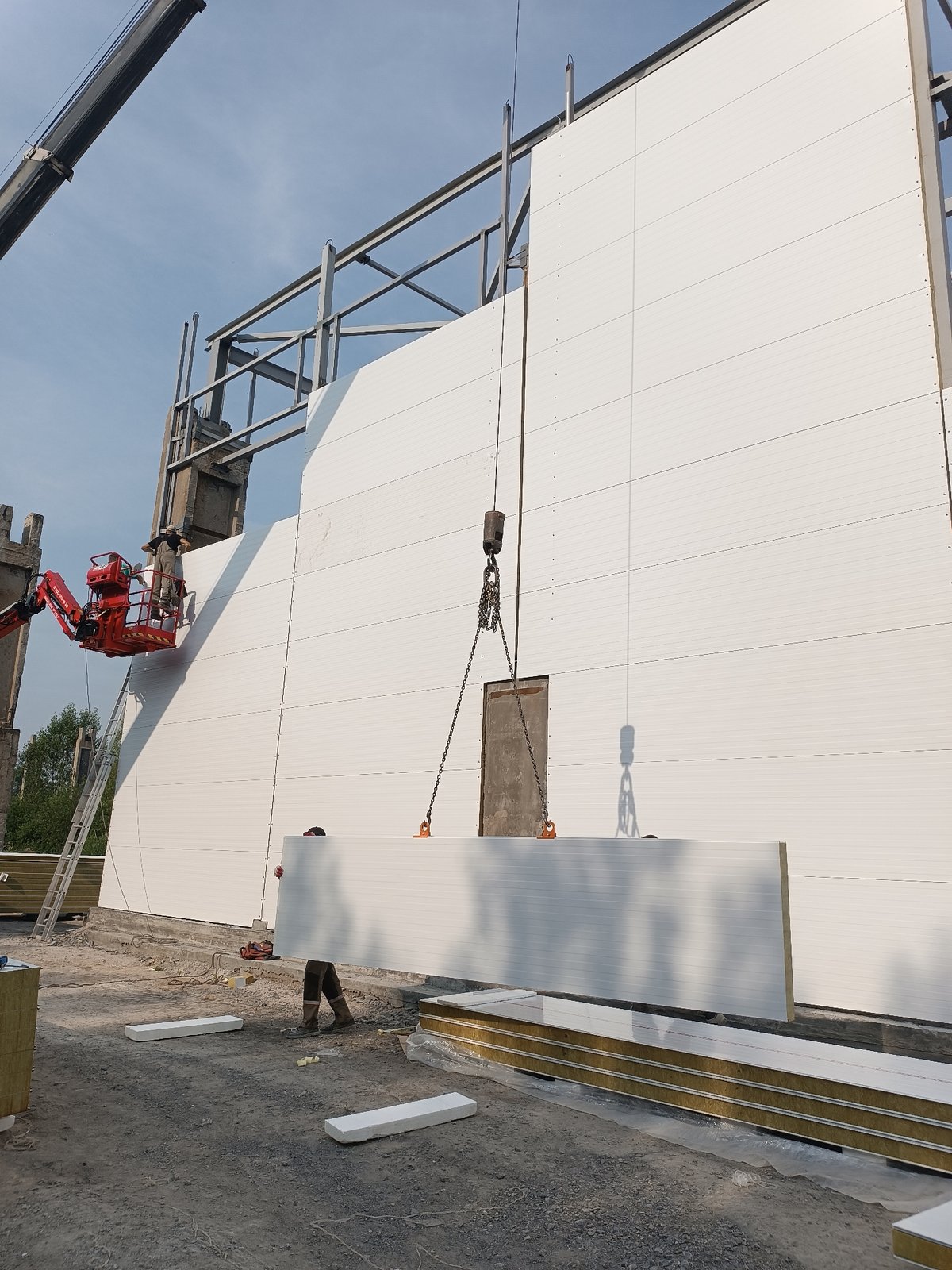 Insulated panels going up on a steel-frame building site
