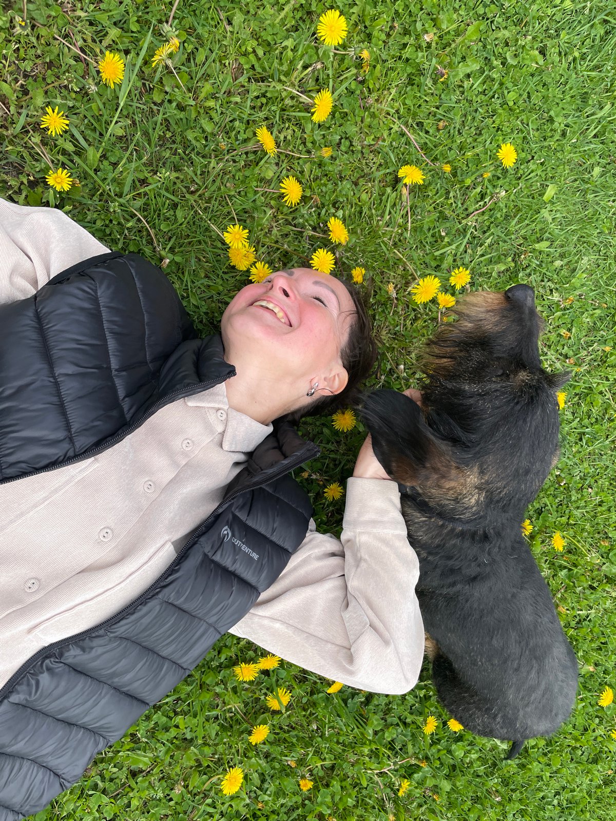 Woman and dachshund enjoy spring afternoon in Russian countryside