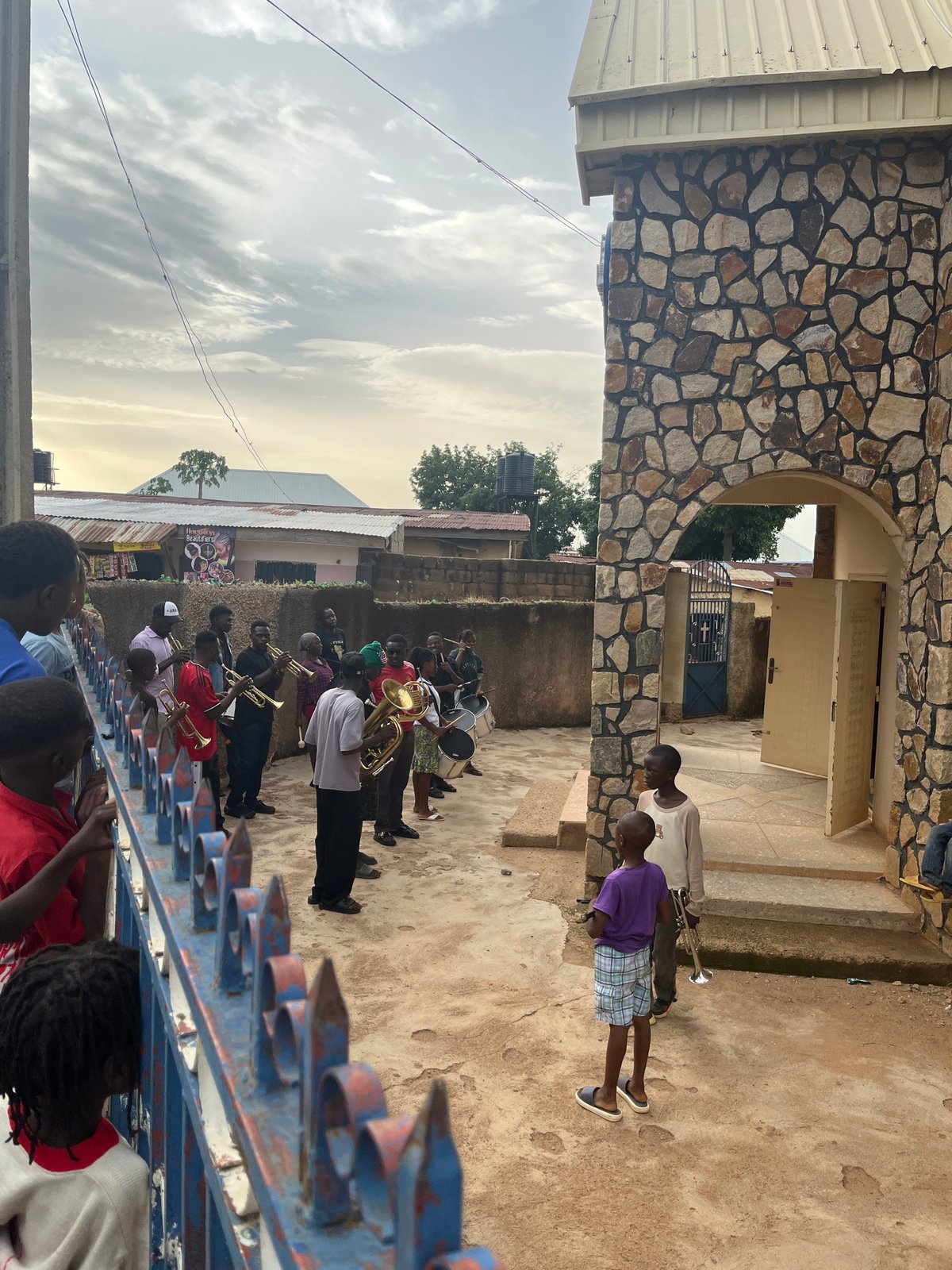 Brass band performs in Gura Top as street life continues in Jos