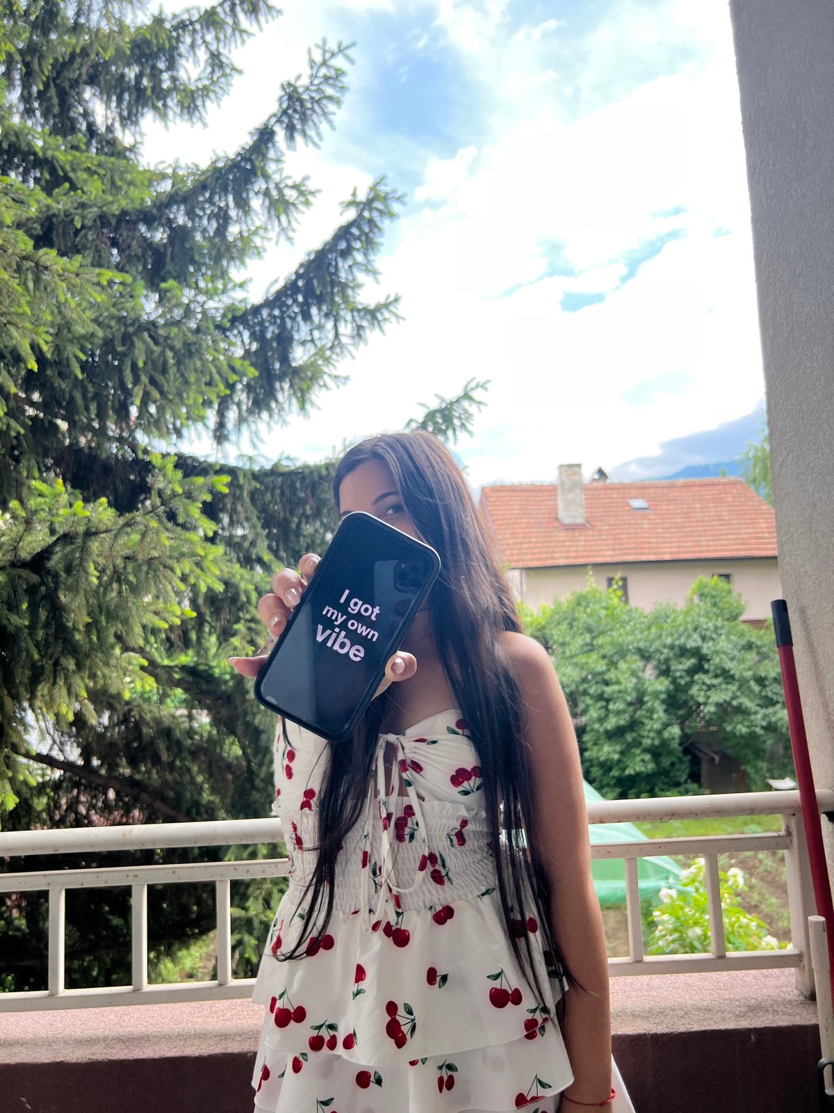 Woman photographs daily life moments from Sofia balcony