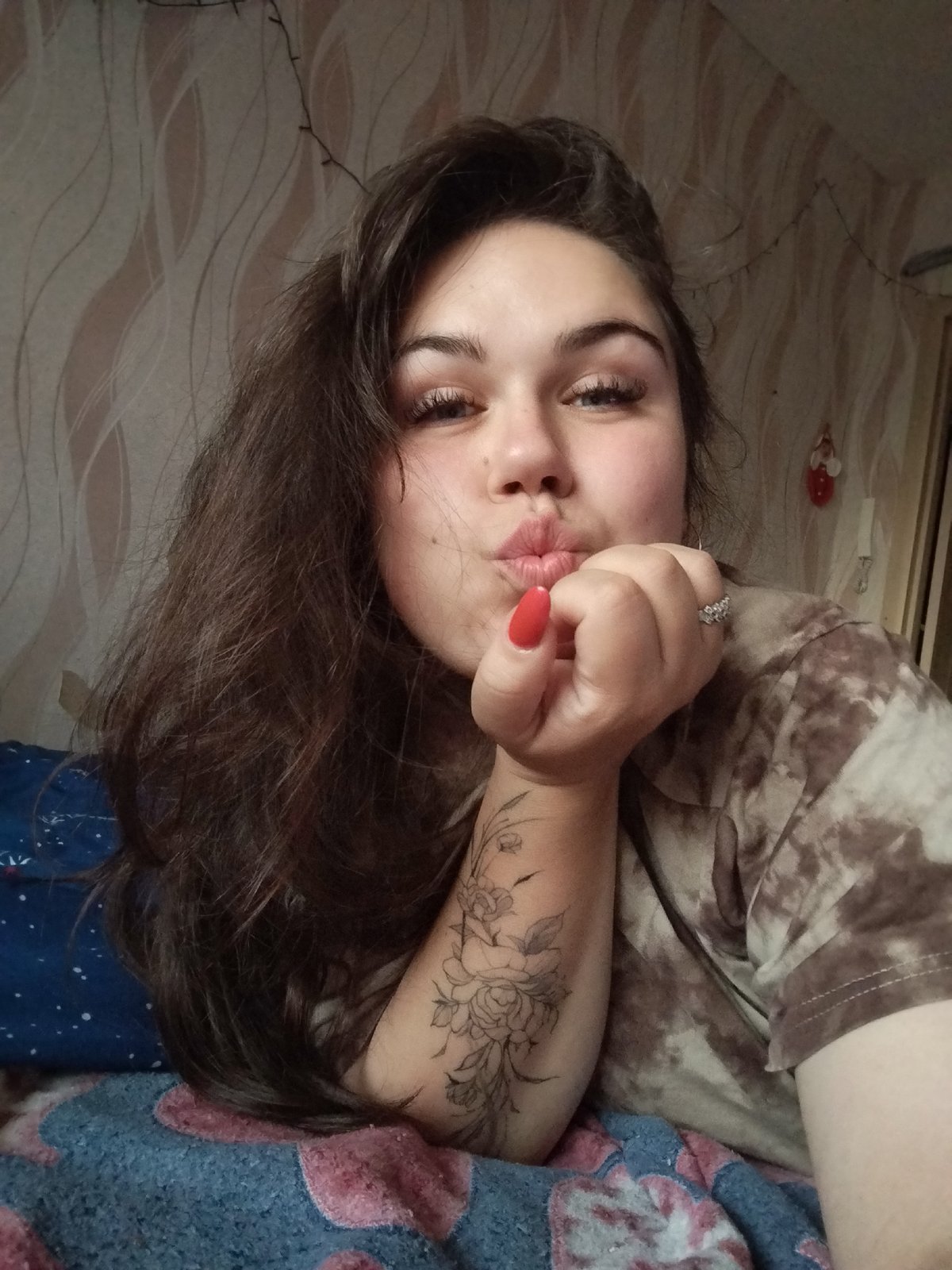 Woman takes selfies at home with child and cat