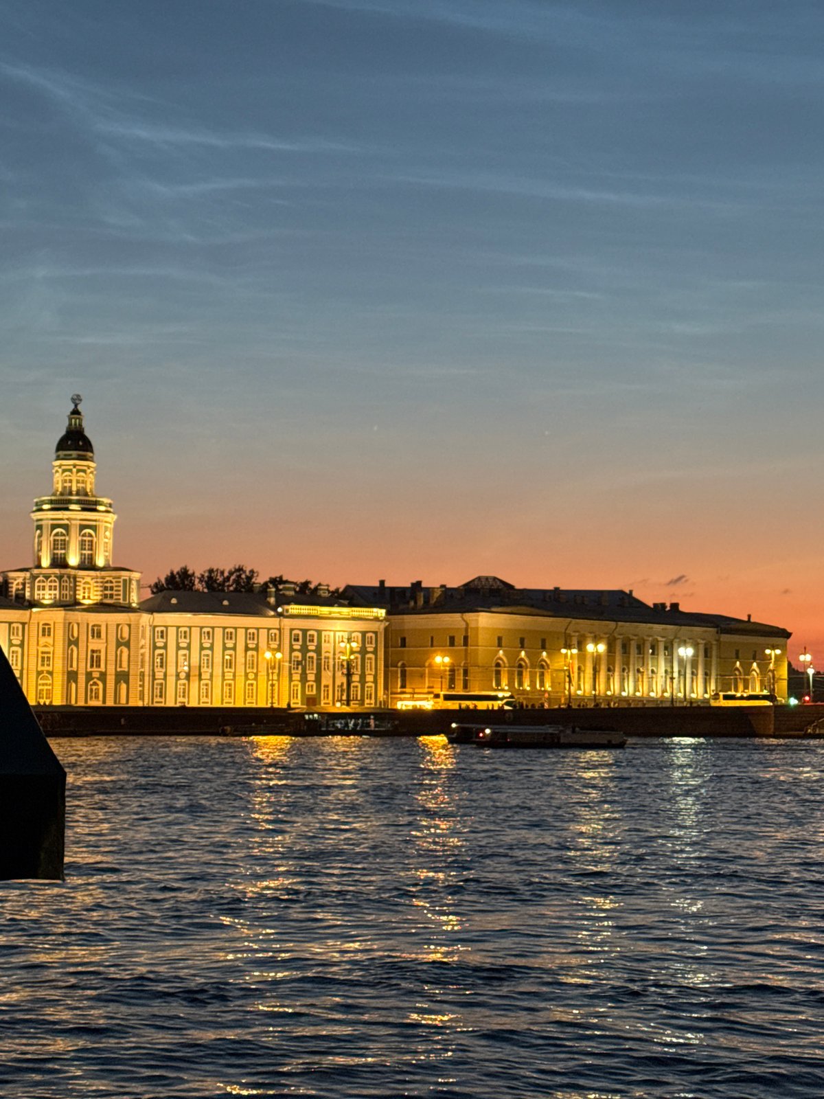 Dusk on the Neva: boats, bridges, and Saint Petersburg landmarks