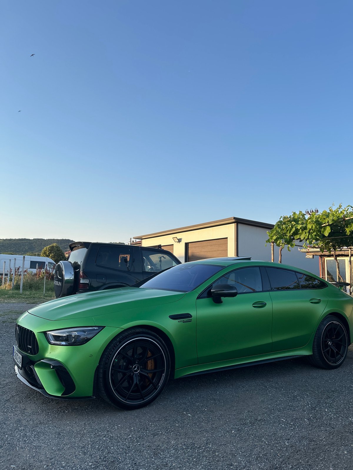 Matte green Mercedes-AMG GT 63 S parked at Slanchevo property