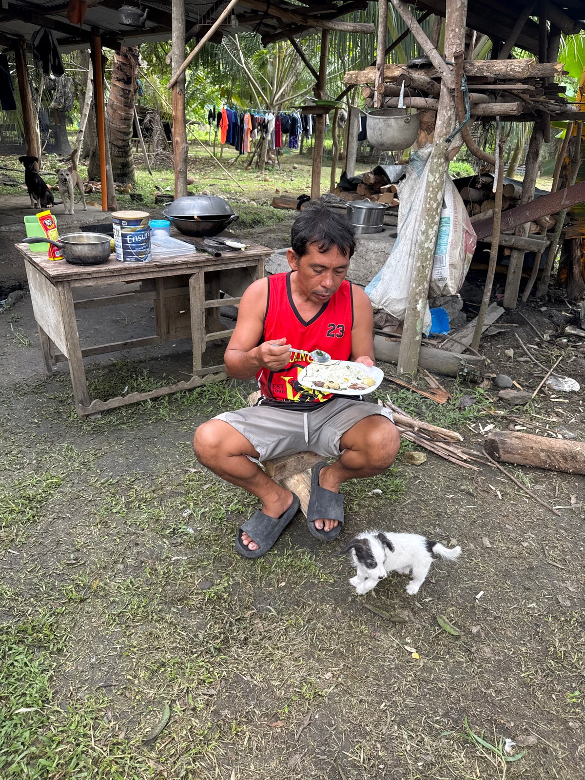 Traditional Filipino birthday celebration with communal outdoor feast in Carmen