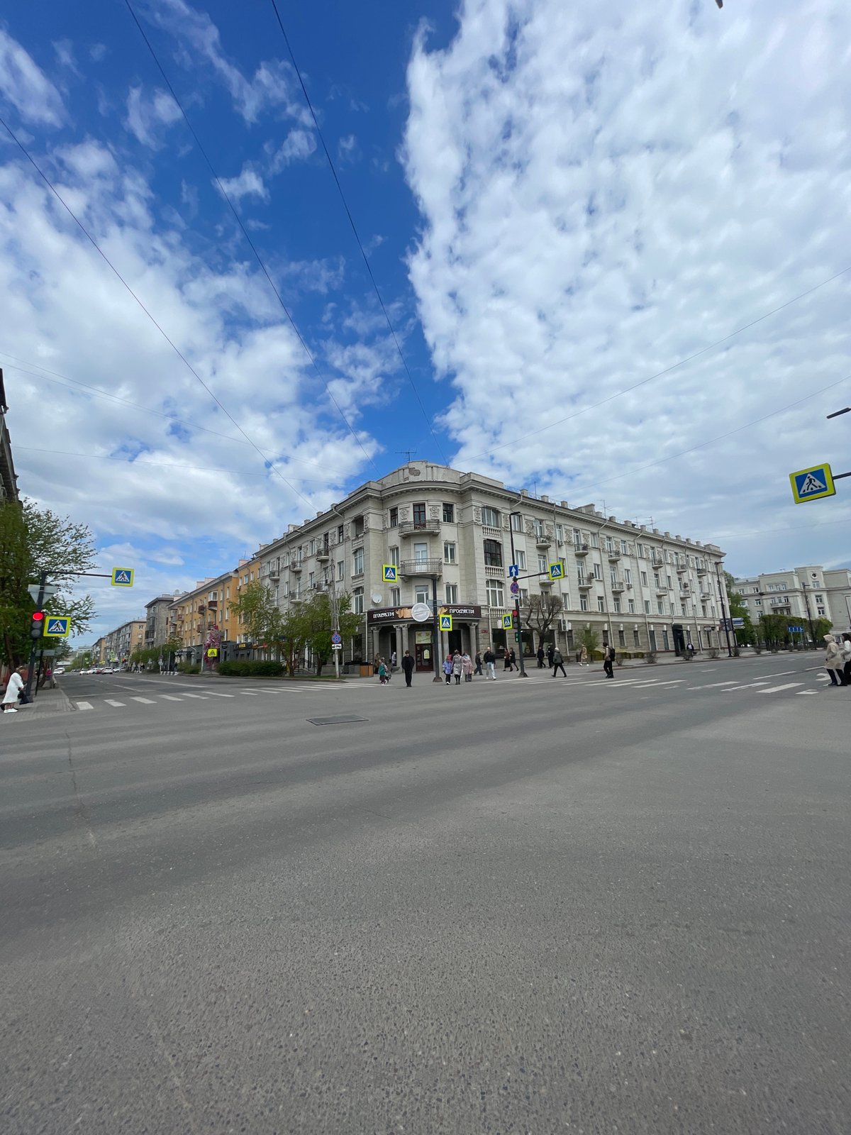Street scene documented in Krasnoyarsk showing curved building facade