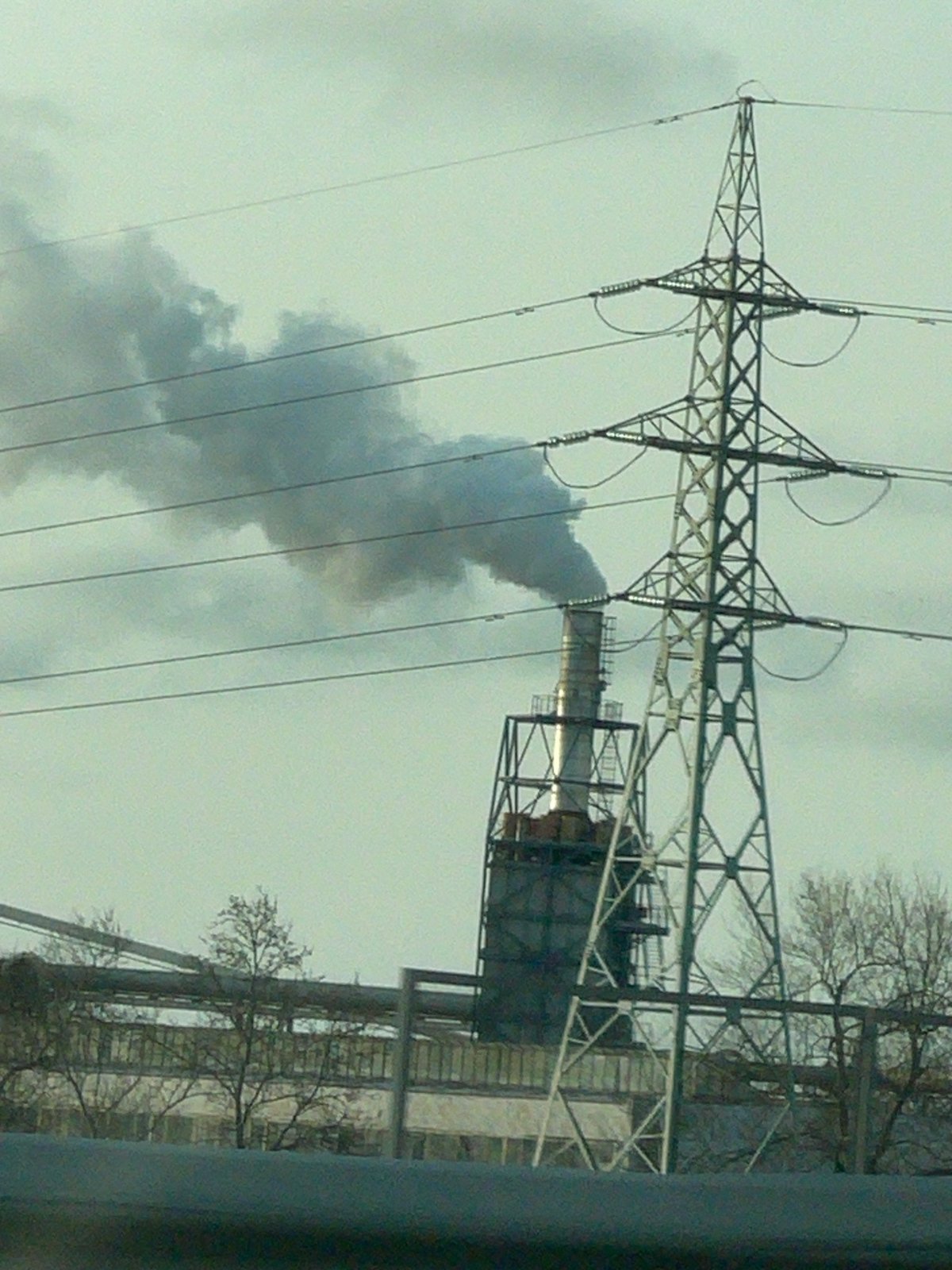 Industrial smokestack emits smoke in Burgas, Bulgaria