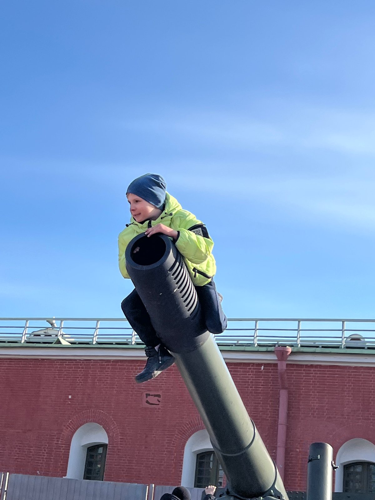 Child climbs into historic cannon at Peter and Paul Fortress