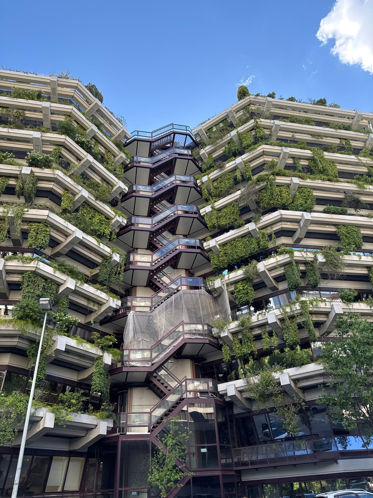 Barcelona building with angular concrete balconies captured by witness