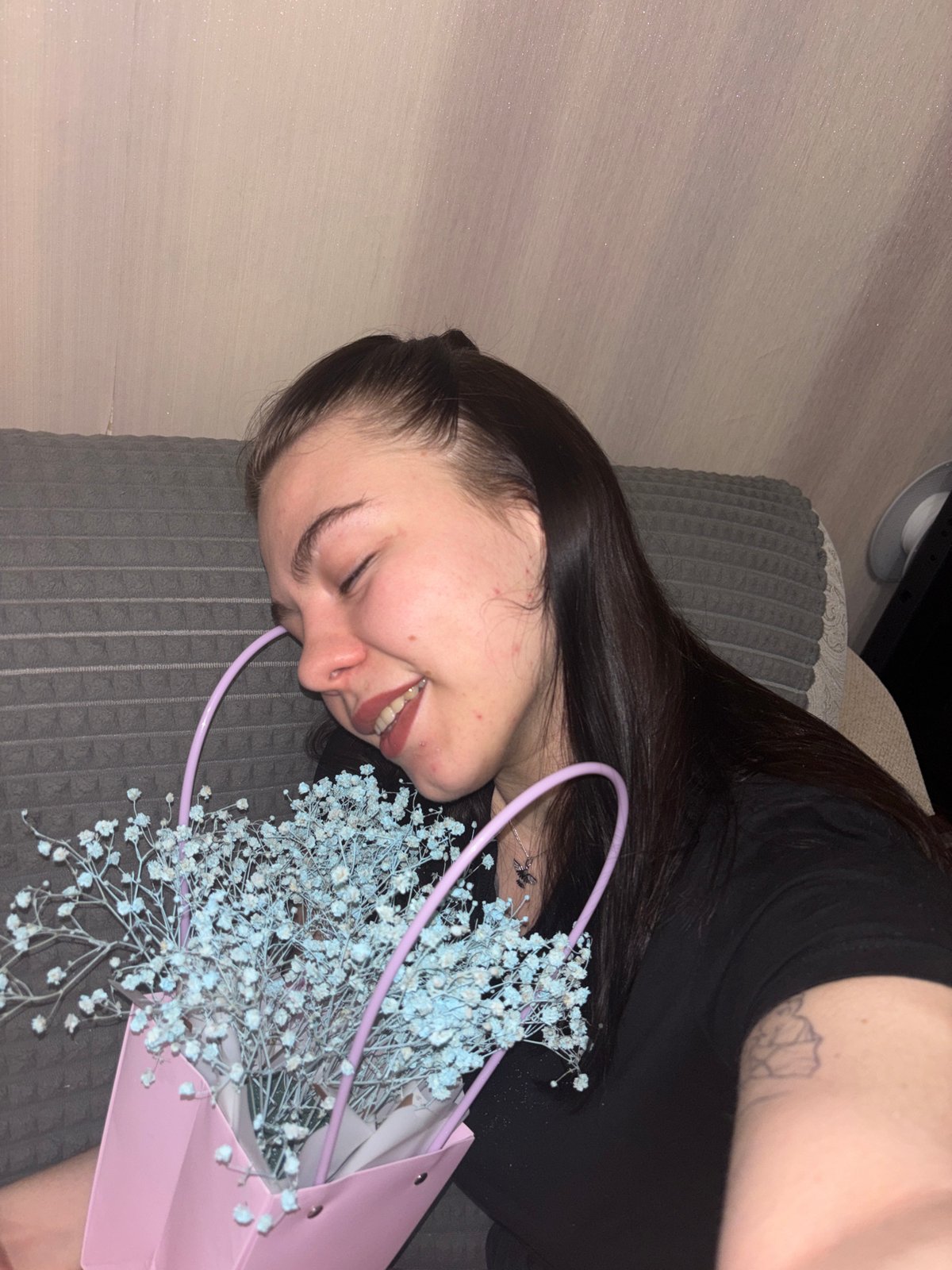 Woman relaxes at home in Perm during Saturday afternoon
