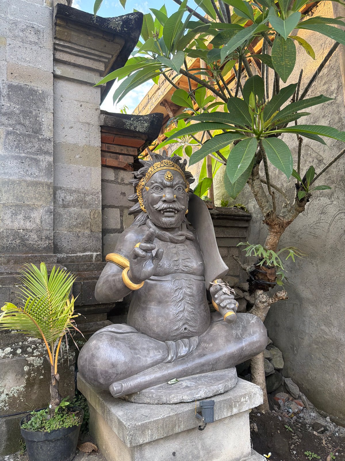 Ubud streets, temple gates, and cremation ceremony preparations