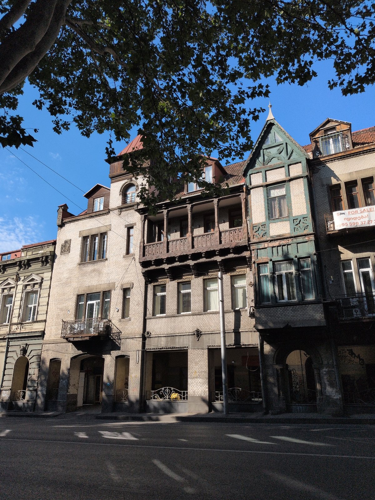 Tbilisi street scenes featuring ornate stonework and historic facades