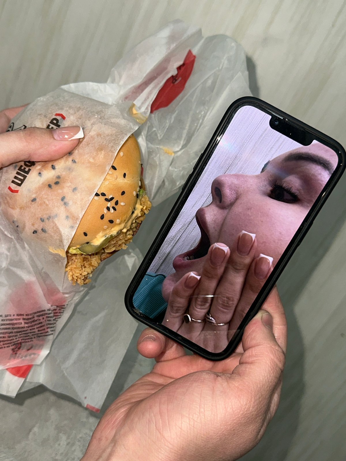 Person with bag over head enjoys Rostic's meal in Chaikovsky