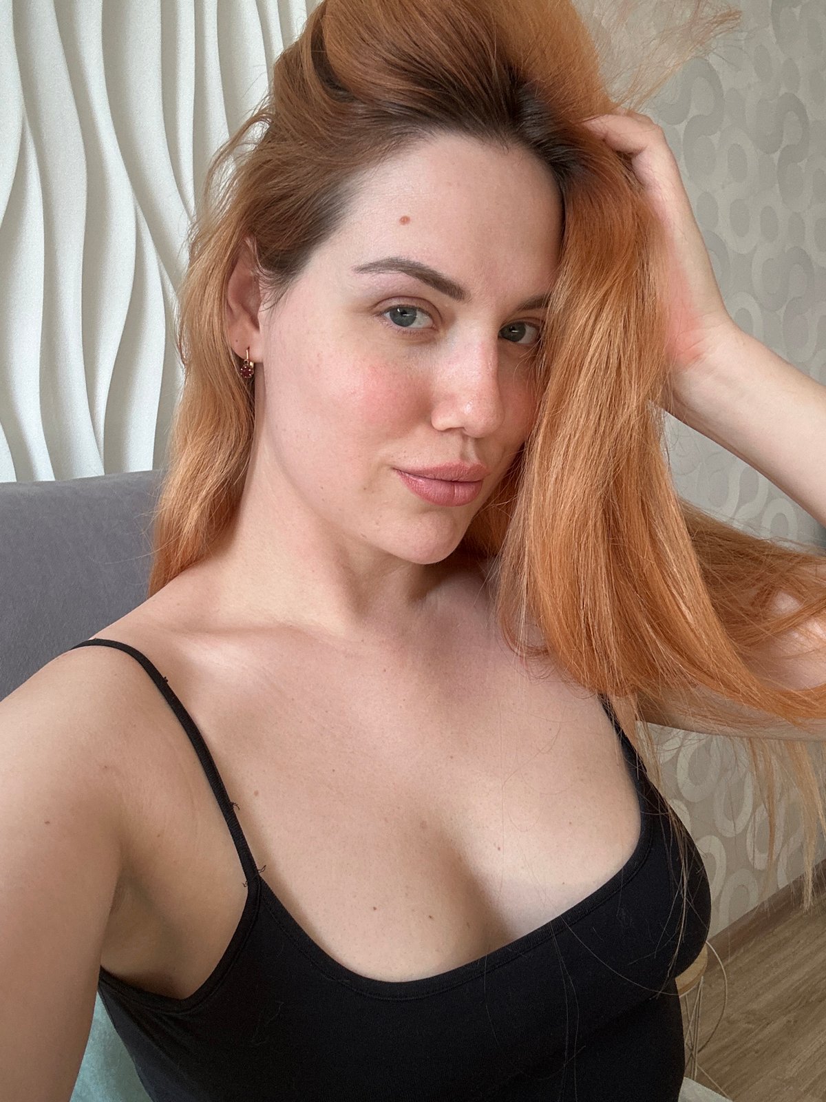 Close-up portrait, black tank top, direct gaze, Odesa