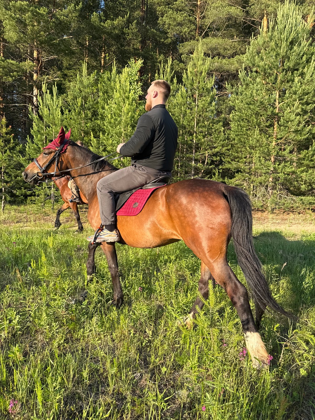 Horseback riders explore countryside near Chaykovsky, Russia