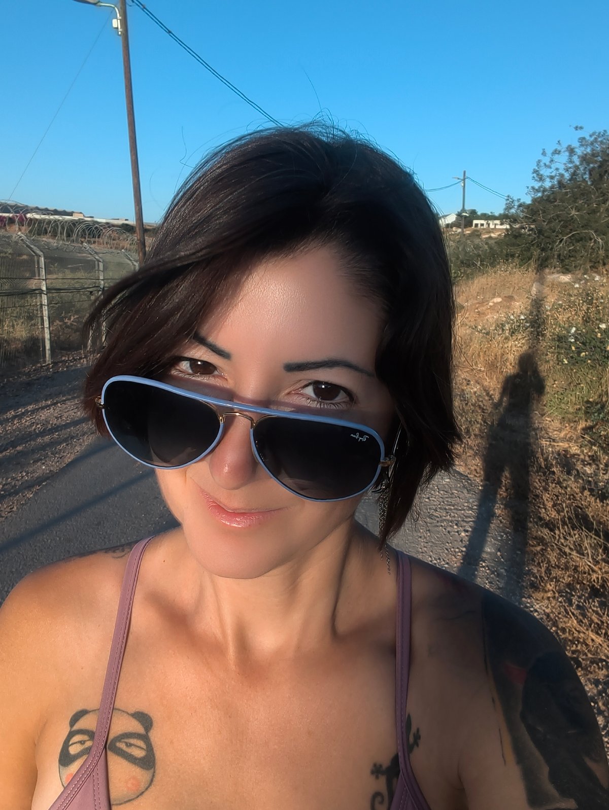 Woman photographed in rural Israeli countryside during golden hour
