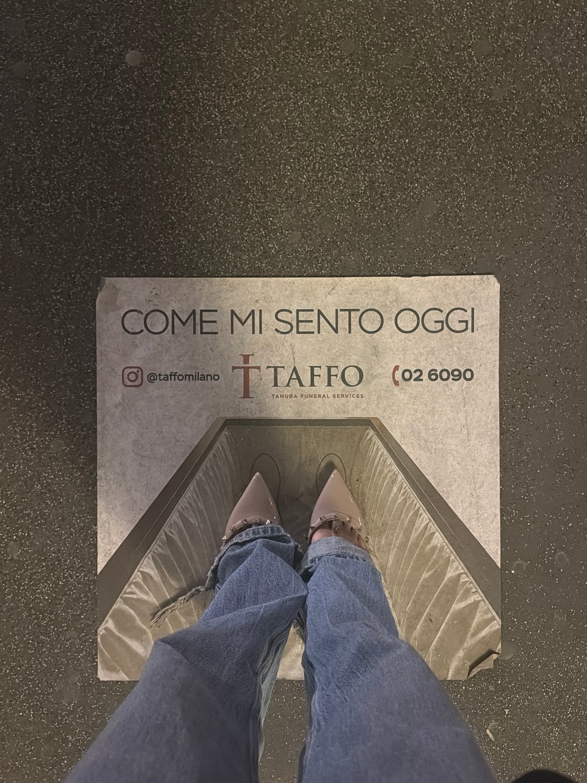 Person stands near feelings sign in Milan