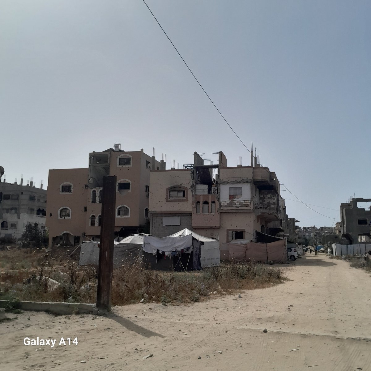 Damaged buildings documented on Nuseirat street, Palestinian Territories