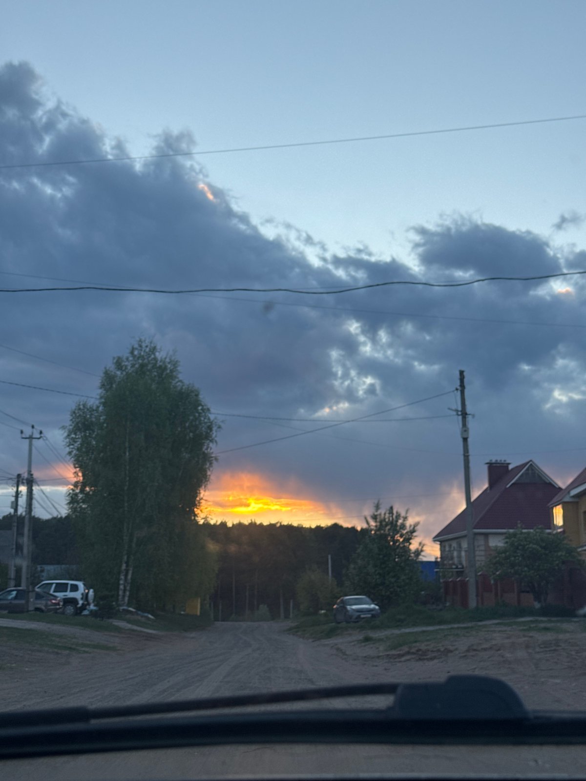 Evening rural view captured from vehicle near Chaikovsky, Russia