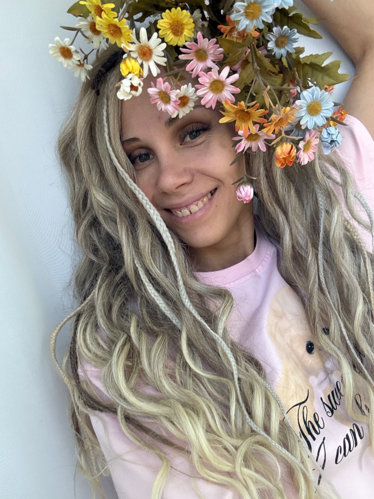 Woman poses with floral crown in Russian studio session