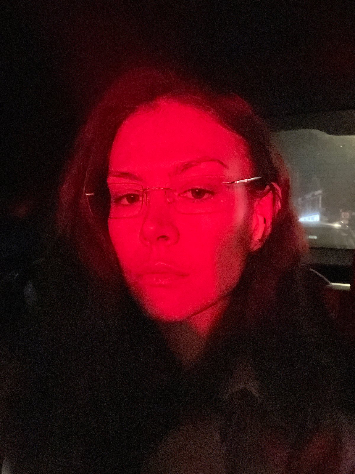 Red-lit portrait captured in London evening