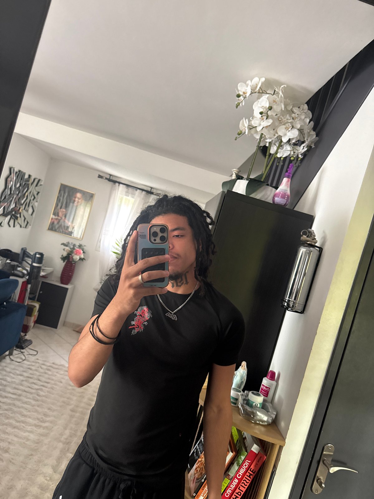 Young man takes multiple selfies in French village
