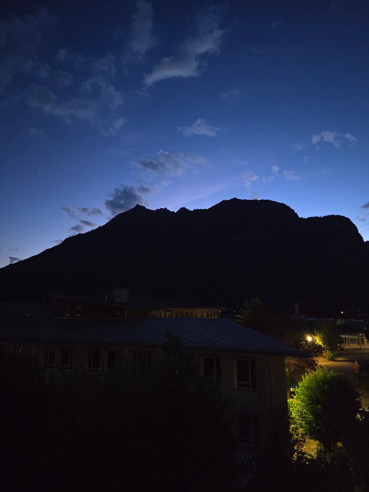 Dusk settles over Garmisch-Partenkirchen's Alpine rooftops