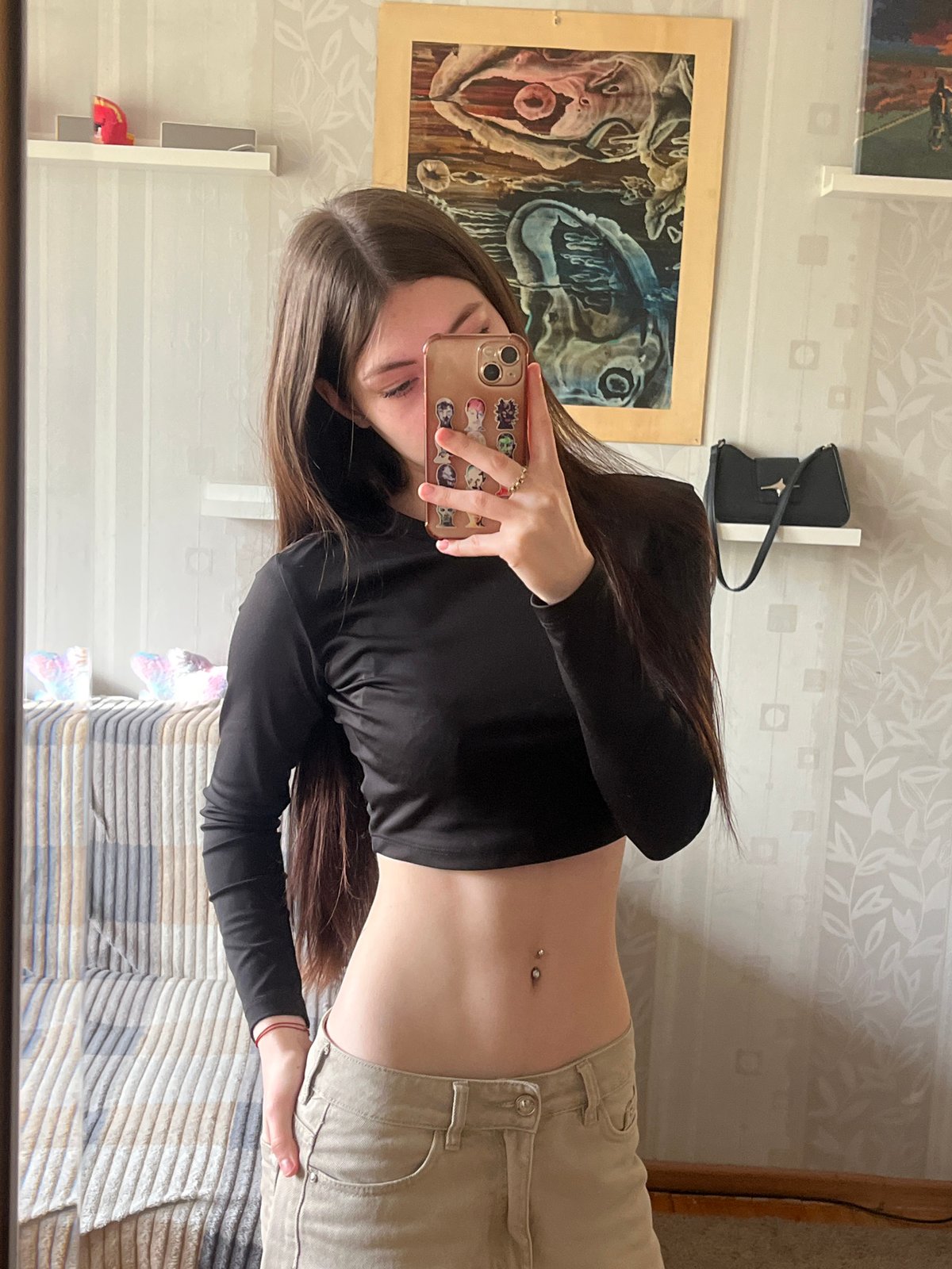 Young woman documents casual selfie session in Russian home