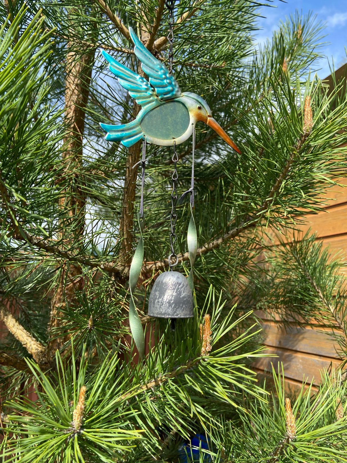 Peaceful moments captured: wind chime, sleeping cat, birch forest