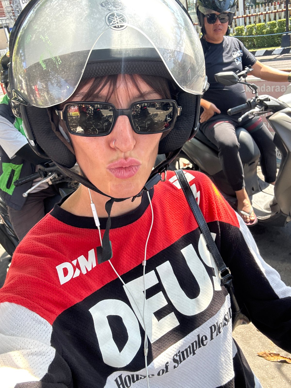 Scooter crew fuels up and takes helmet selfies in North Kuta