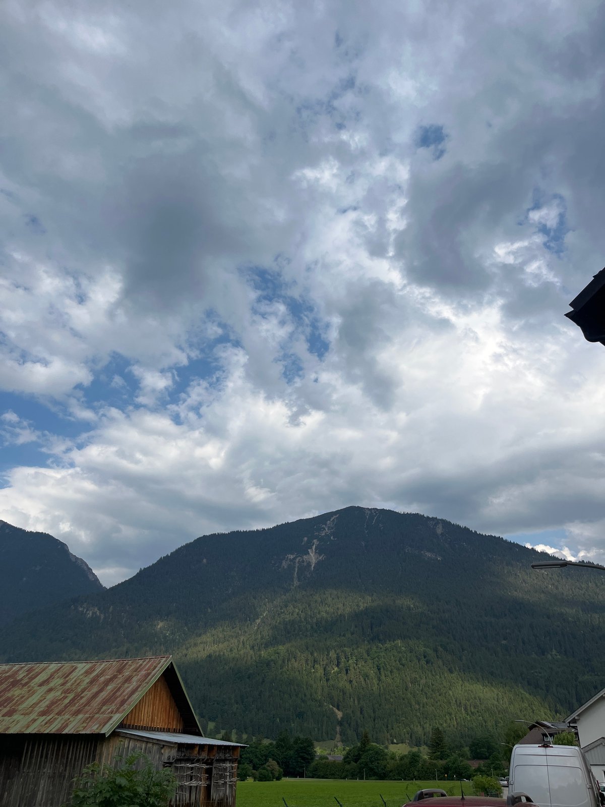 Witness documents overcast afternoon in Garmisch-Partenkirchen's mountain landscape