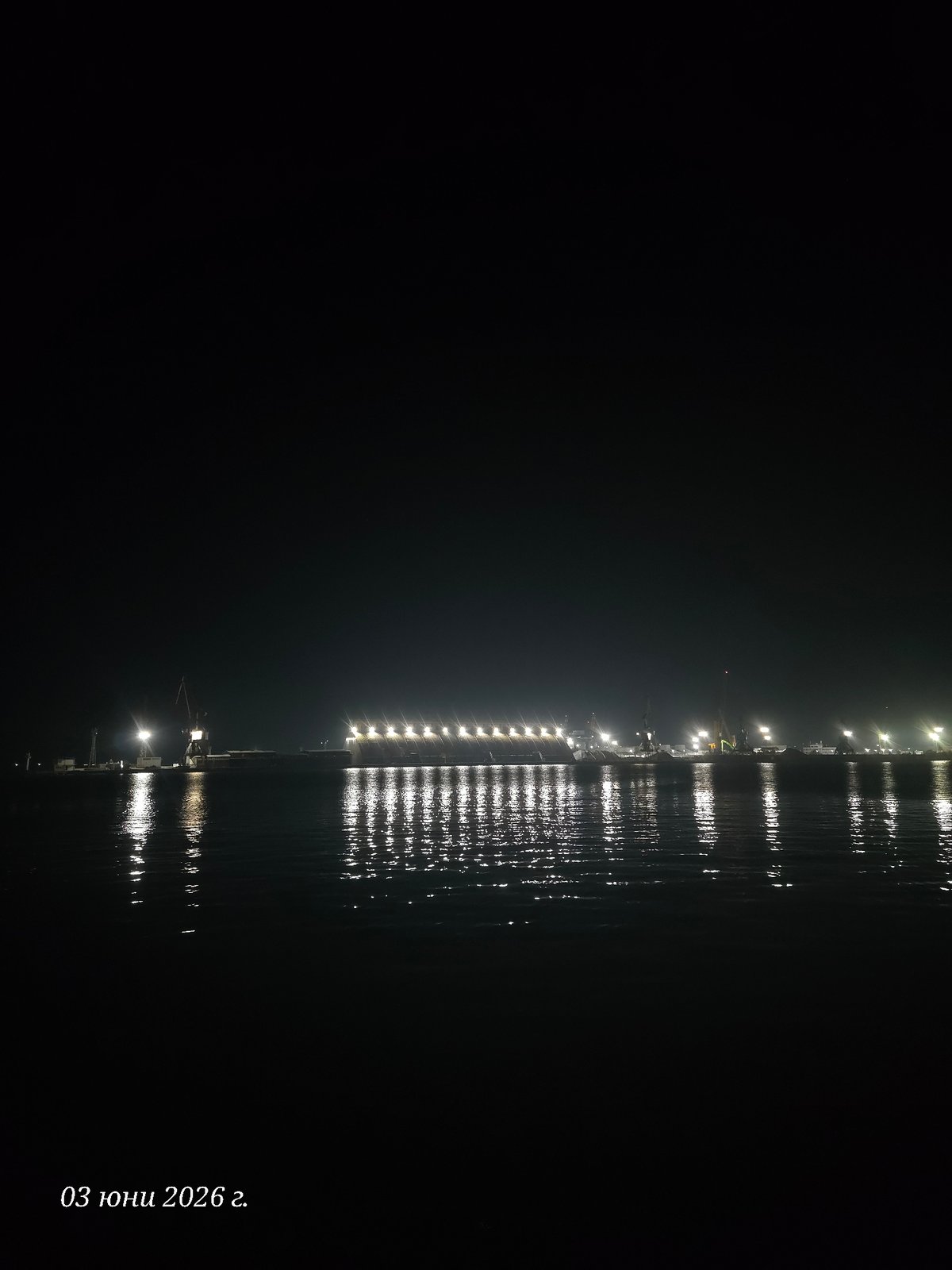 Evening lights illuminate Burgas waterfront and harbor walkways