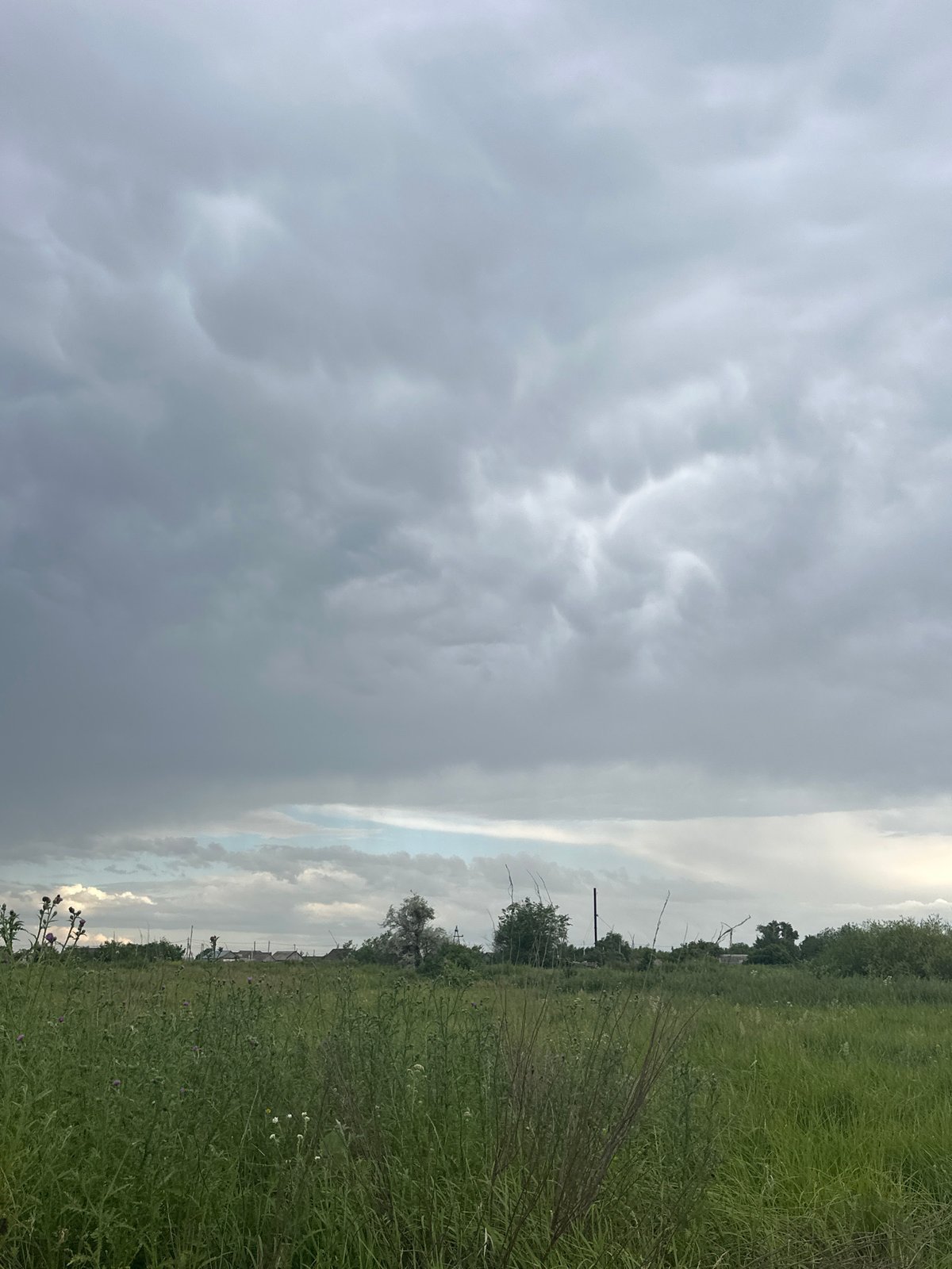 Storm clouds build over open grassland near Tobyl, Kazakhstan