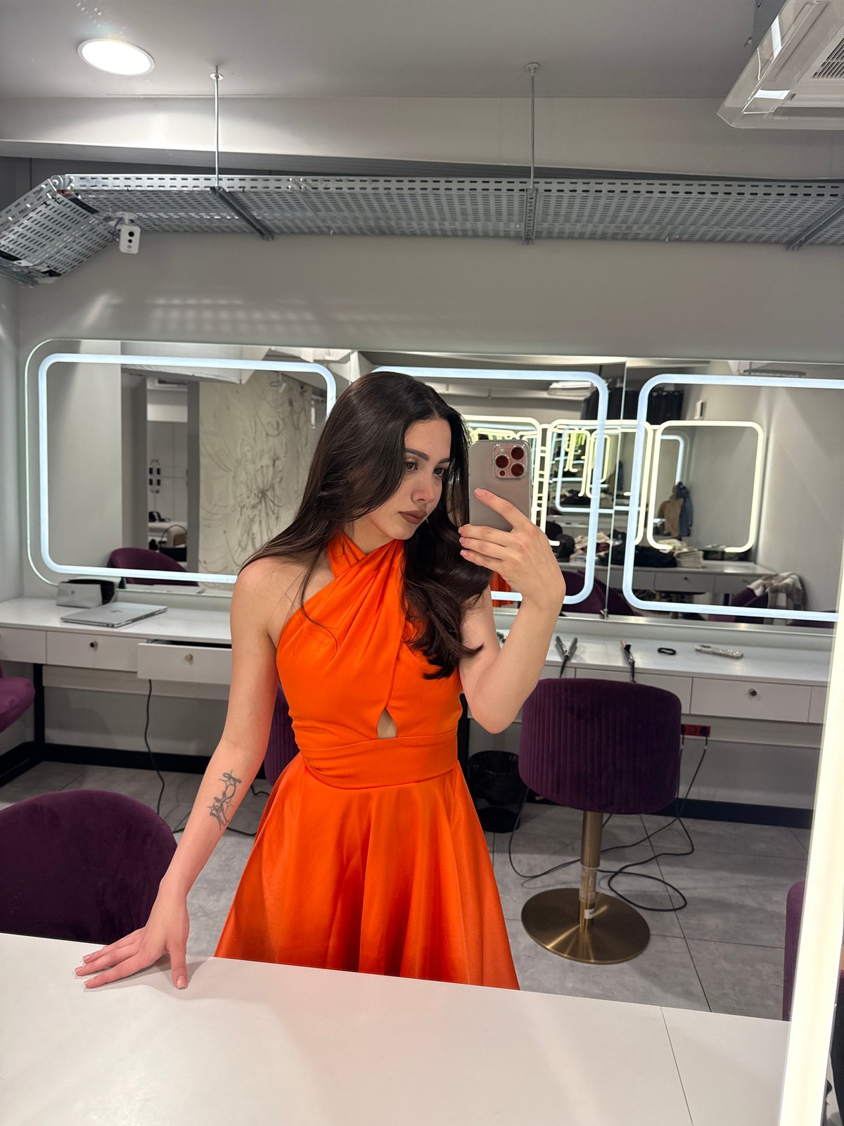 Woman takes mirror selfie in Yerevan beauty salon