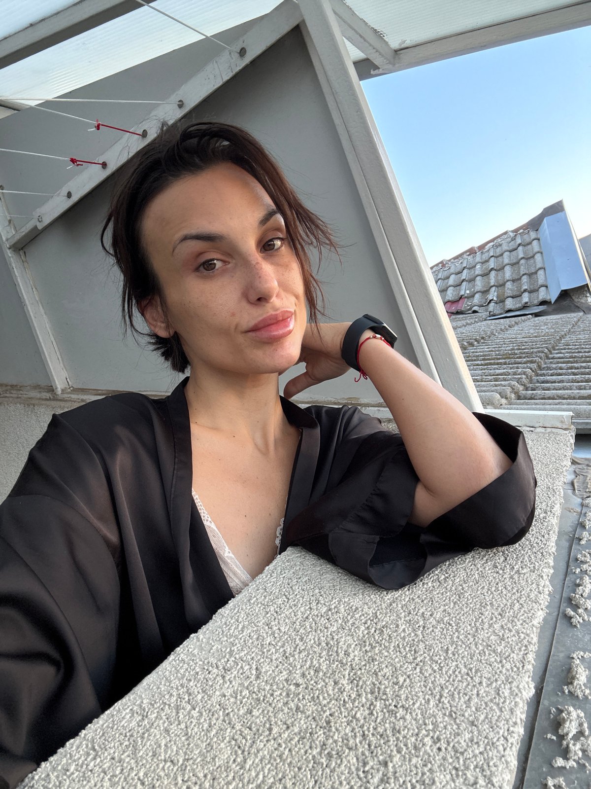 Morning selfie session in black robe across Pleven apartment