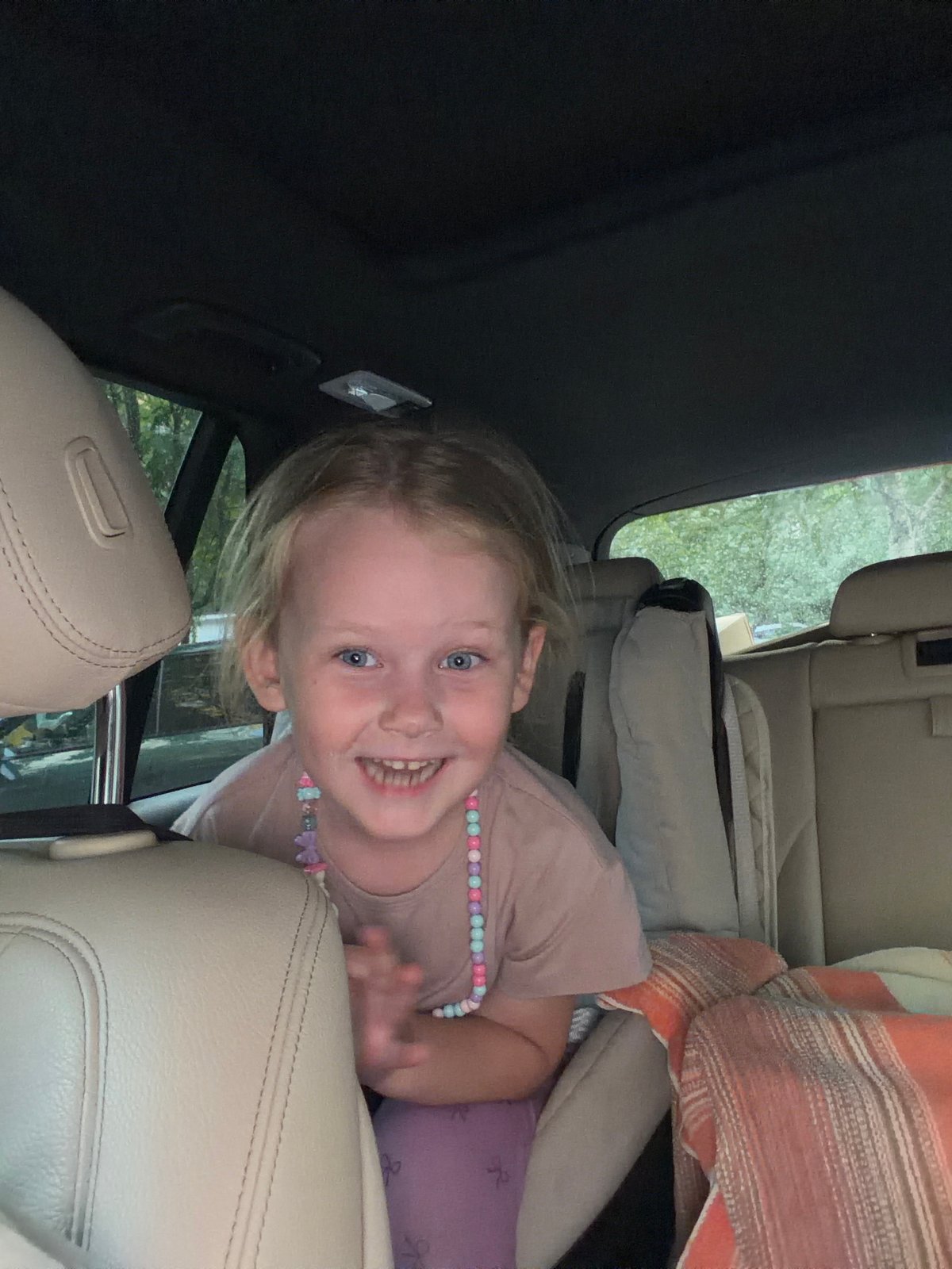 Girl and parrot share car ride in Moscow