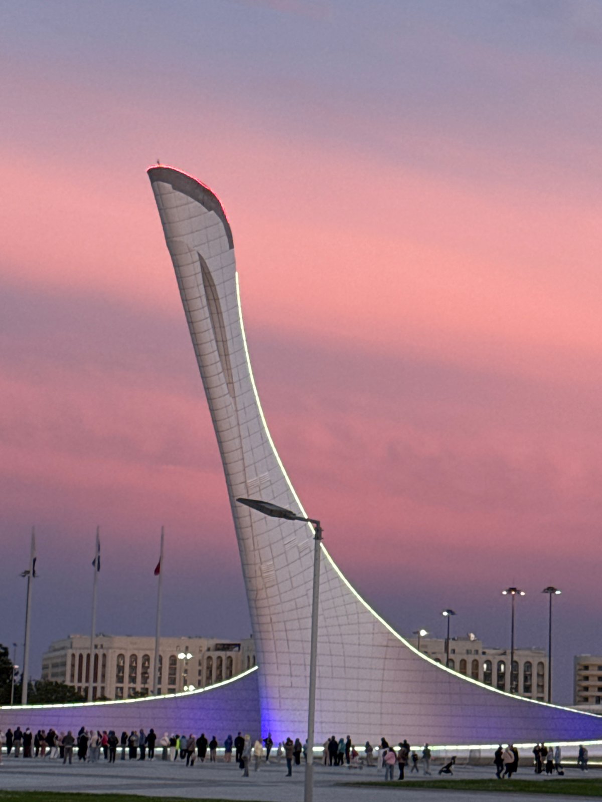 Evening gathering at Sochi Olympic Park draws visitors at sunset